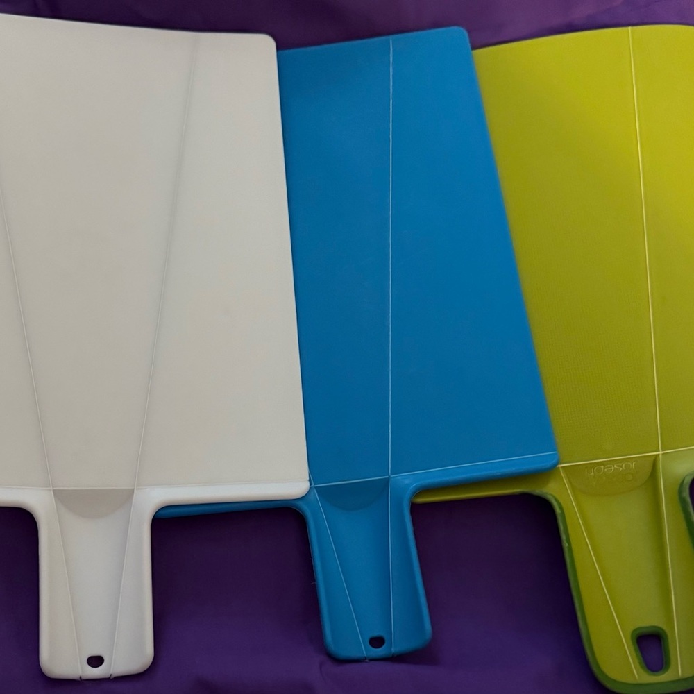 1 Joseph Joseph and 2 other folding cutting boards.